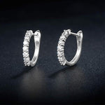 White gold huggie earrings with stones in 14k gold