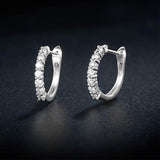 White gold huggie earrings with stones in 14k gold